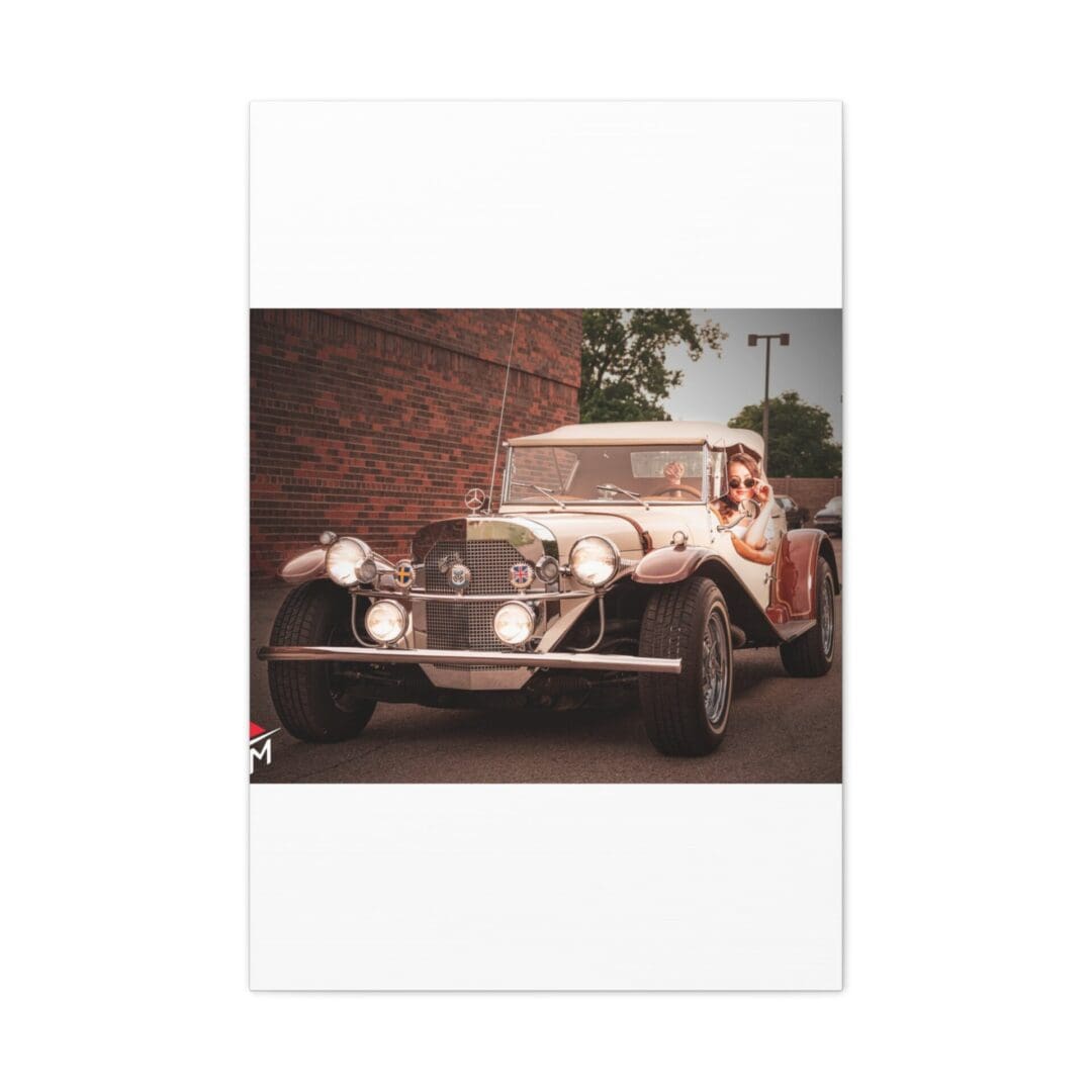 Vintage white classic car parked near a brick wall.