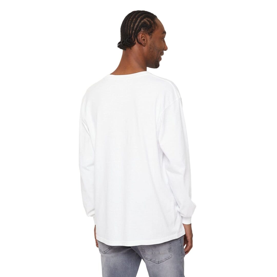 Man wearing a white long-sleeve shirt, shown from the back.