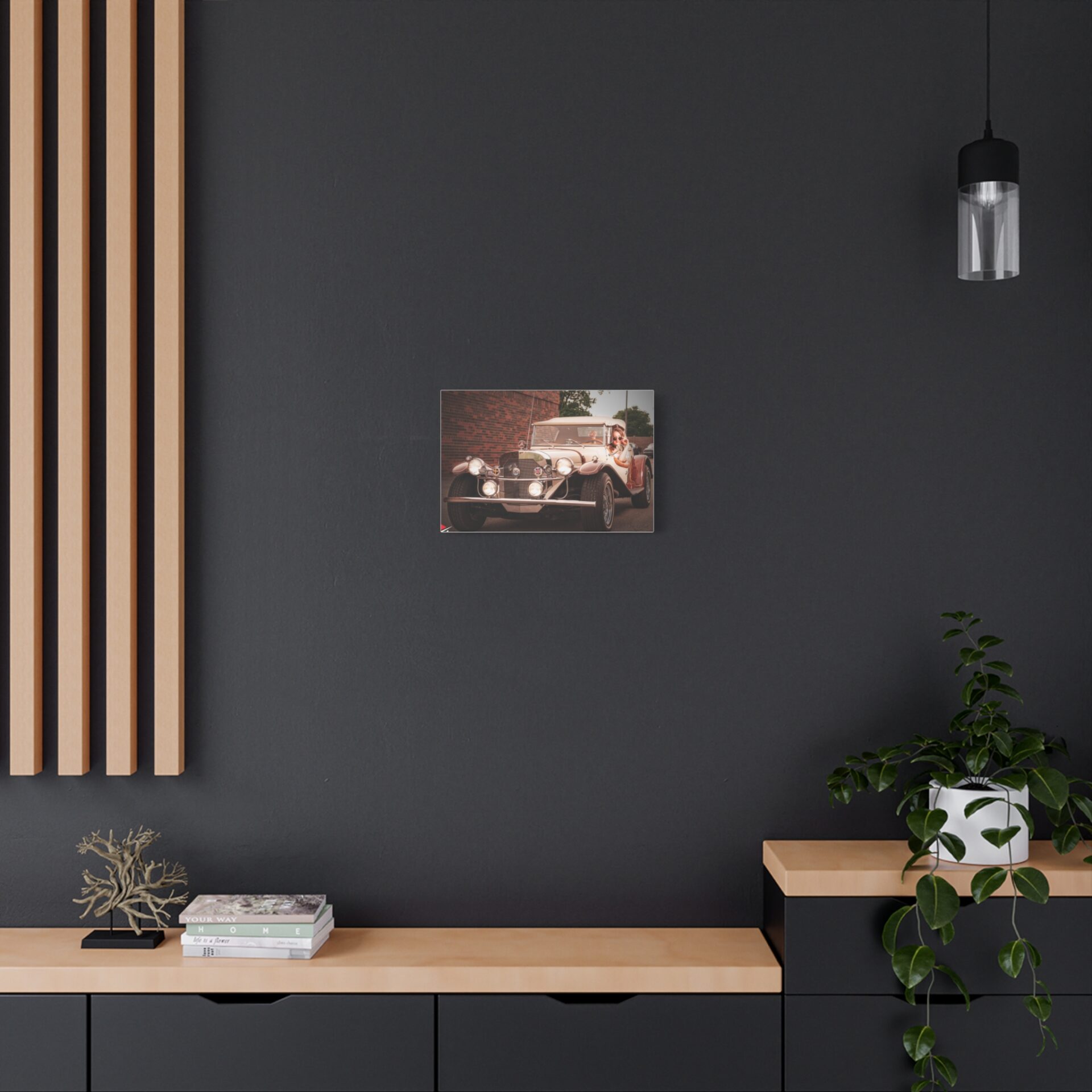 A dark wall with a vintage car picture, wooden shelves, and a hanging light.