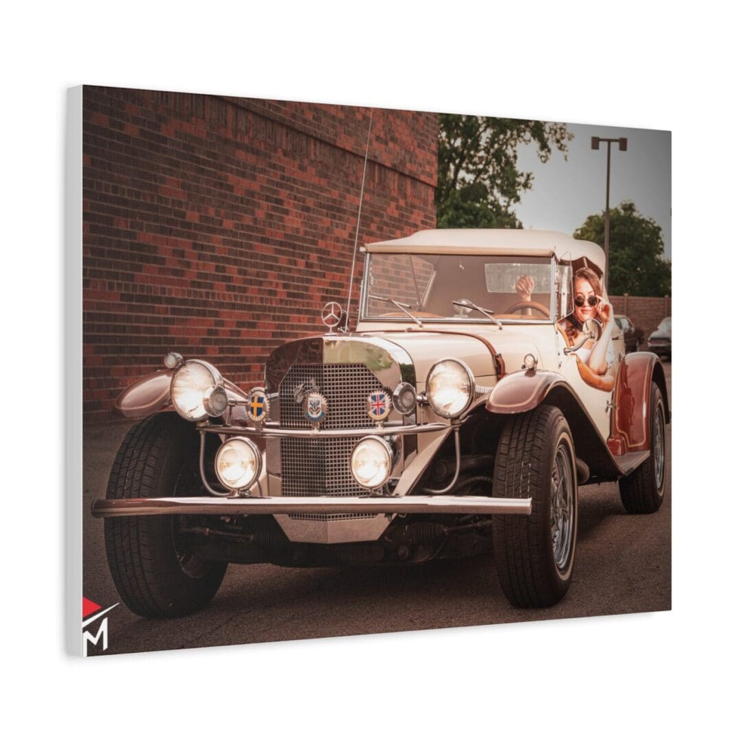 Vintage car parked outdoors with a person inside.