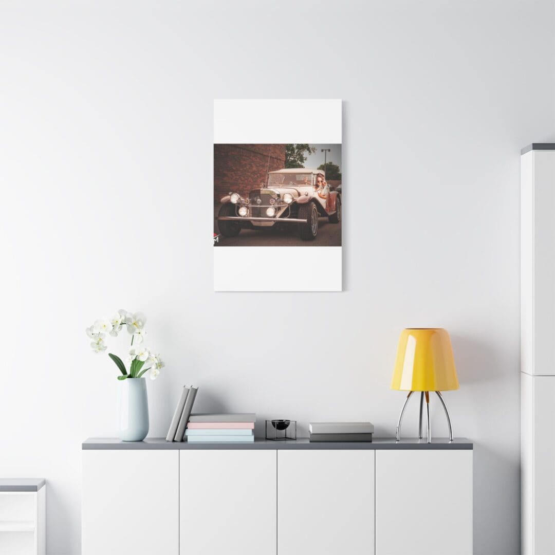 Modern minimalist interior with a white sideboard, yellow lamp, and wall art.