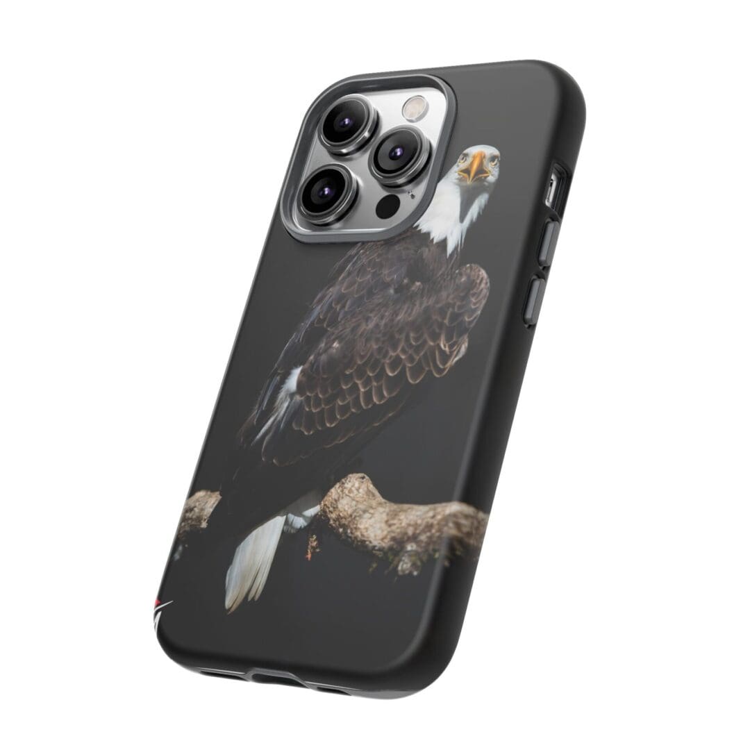 Black phone case with a detailed bird design and gold accents.