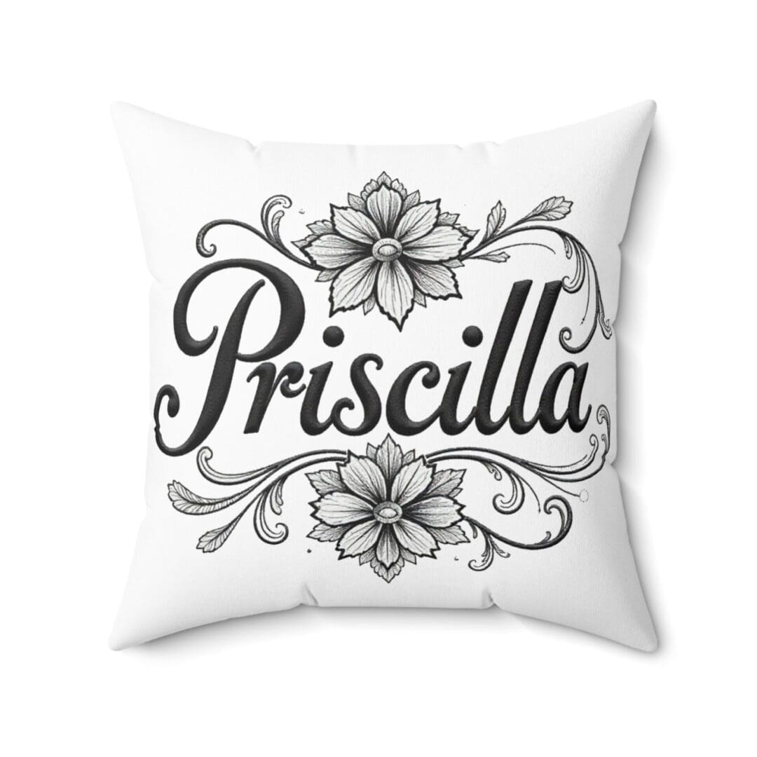 White pillow with the name Priscilla and floral designs.