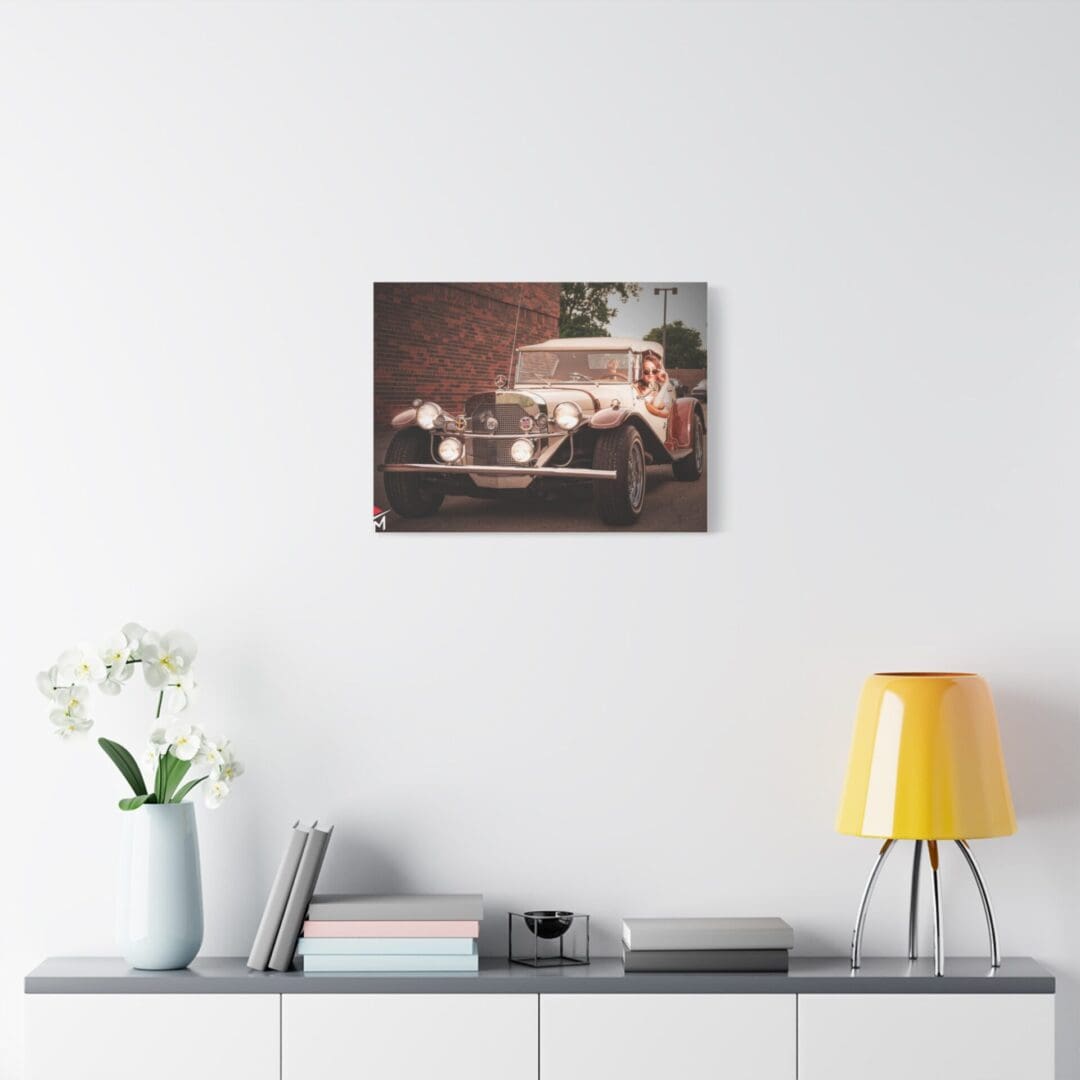Modern living room with a vintage car photo on the wall.