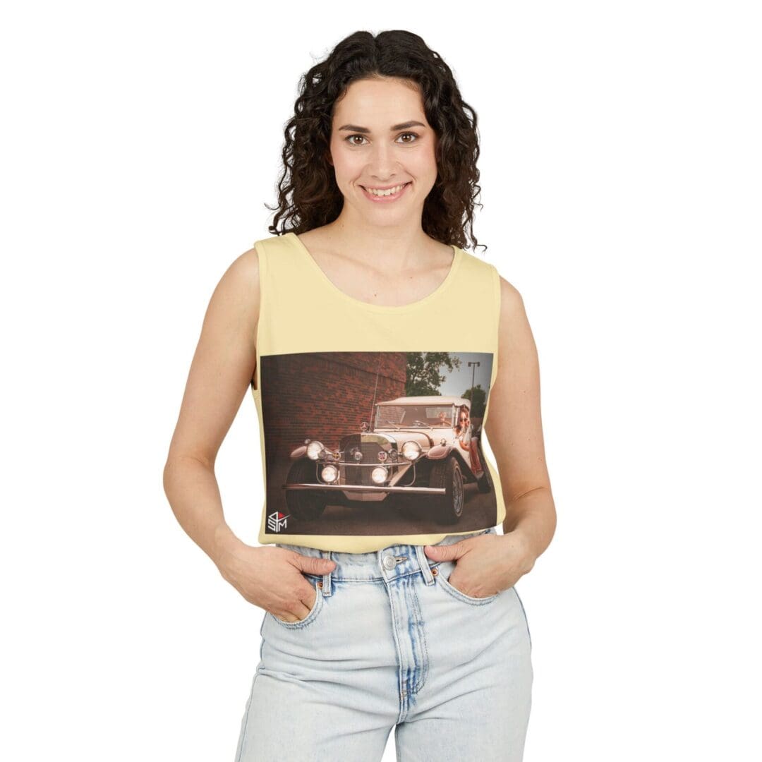 Woman smiling and holding a framed photo of a nighttime city scene.