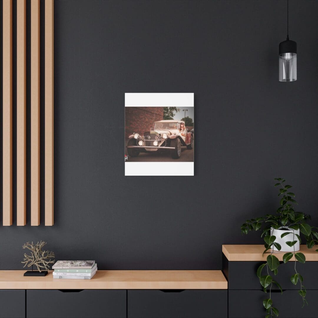 Modern workspace with a dark wall, wooden desk, and a framed picture.