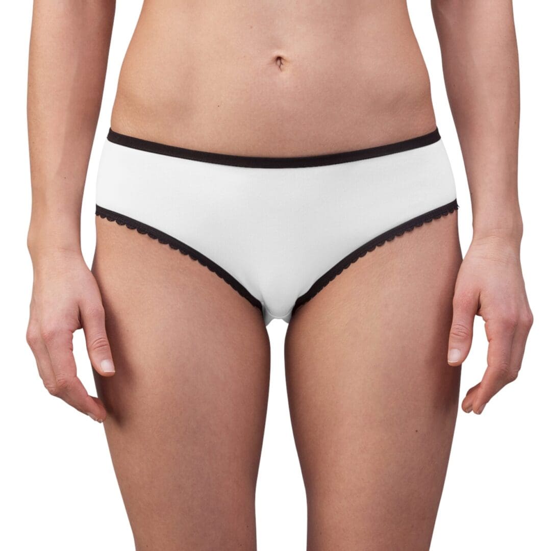 Woman wearing white underwear with black trim.