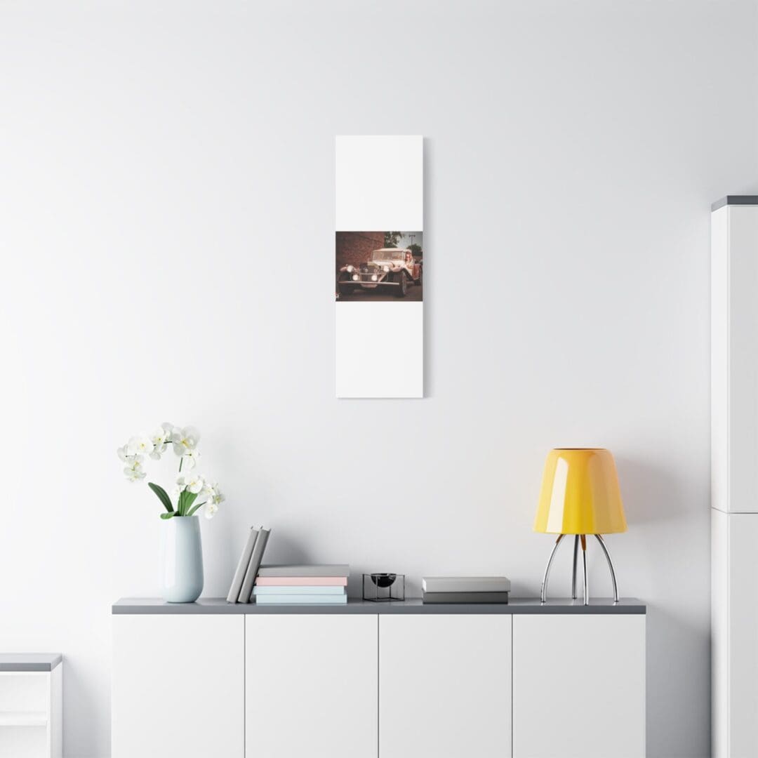 Minimalist room with white furniture, a yellow lamp, and a small wall-mounted photo.