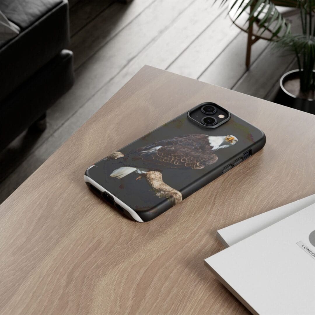 Smartphone with black marble case on wooden table beside papers.