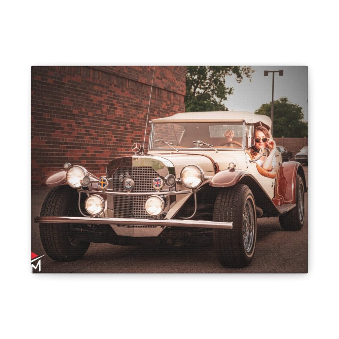 Vintage car with a woman posing beside it on a street.